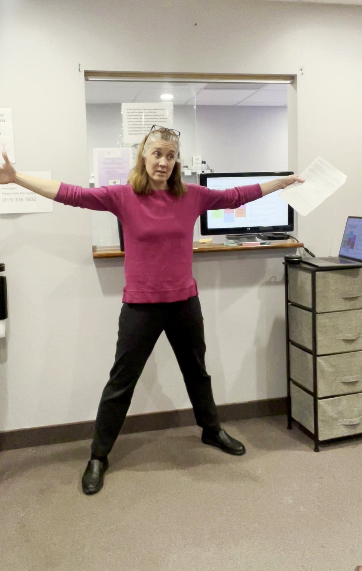 Jennifer Brown speaking, arms wide open and animated, presenting to a group