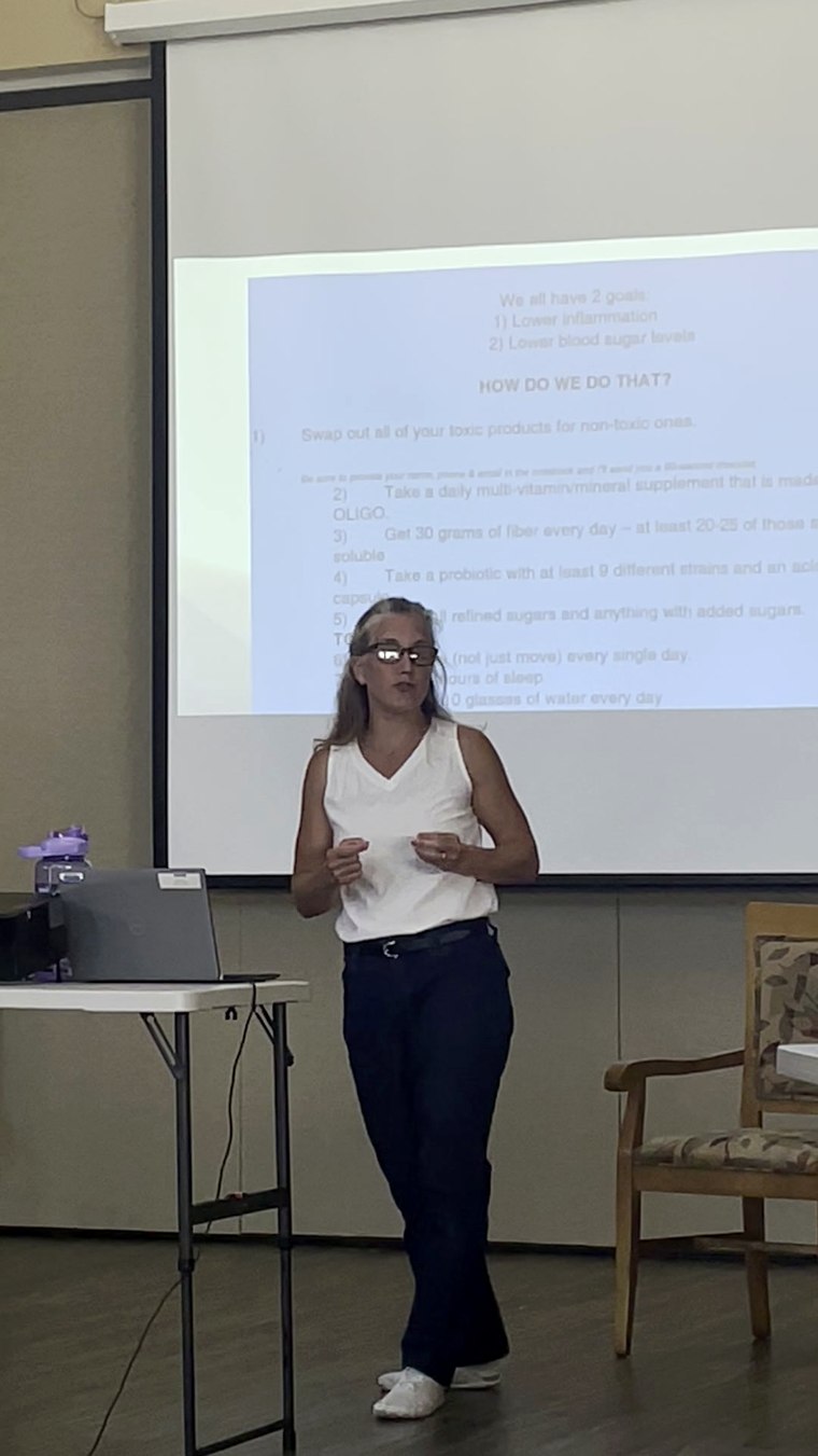 Jennifer Brown speaking to a seated audience